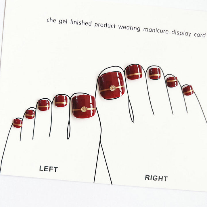 Artificial toenails with elegant gold embellishments Stornfield