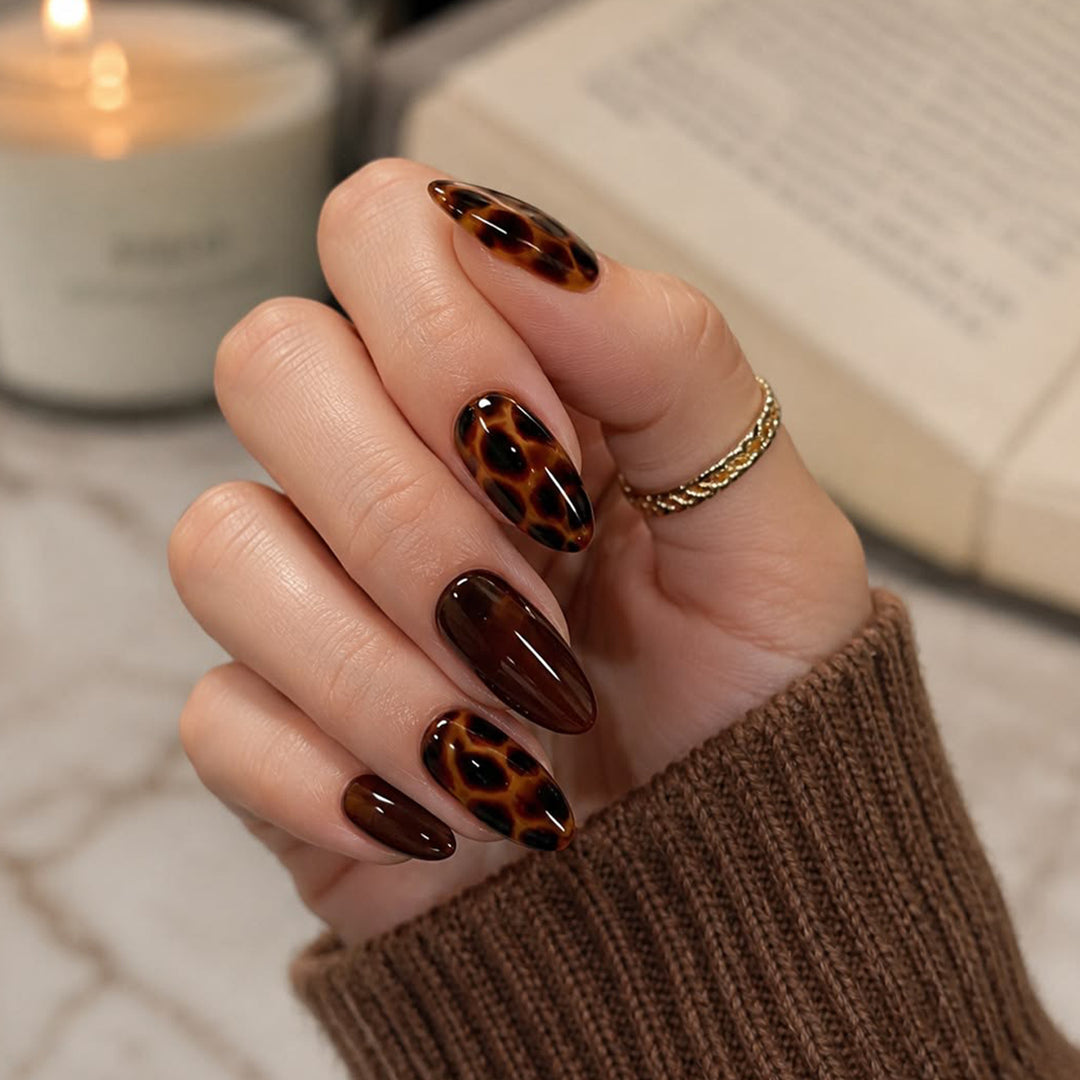 Artful stiletto nails with elegant leopard pattern Stornfield