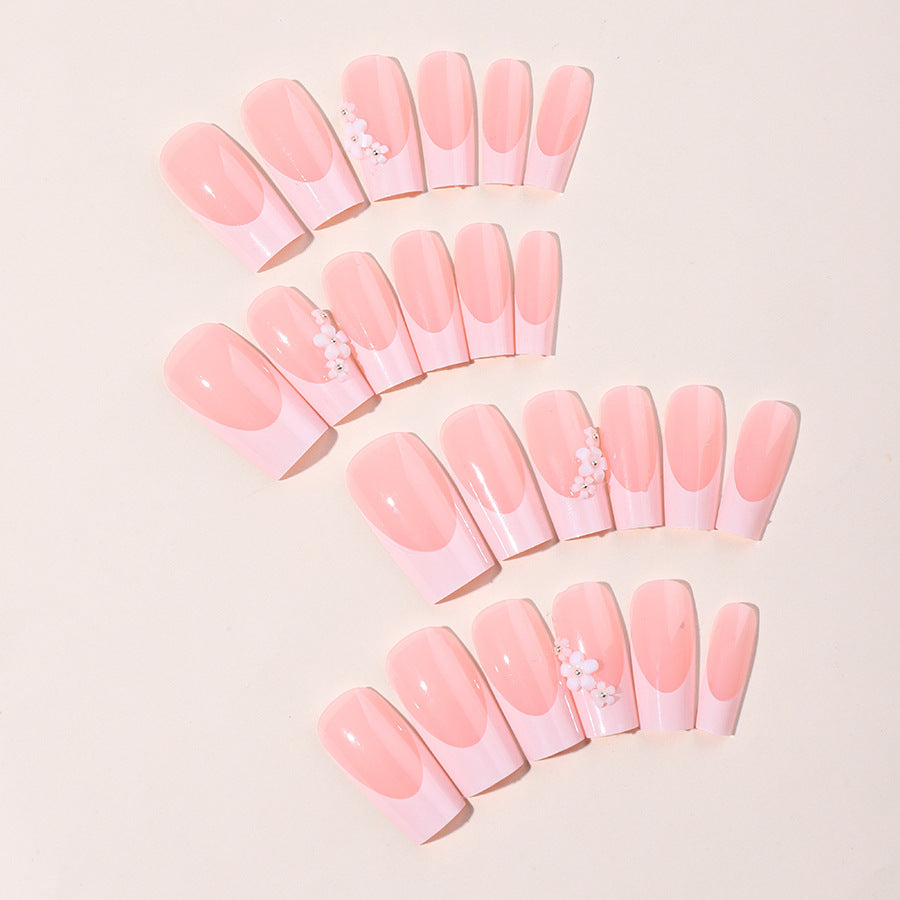 Artificial nail set with elegant French tips and hand-drawn flower motifs Stornfield