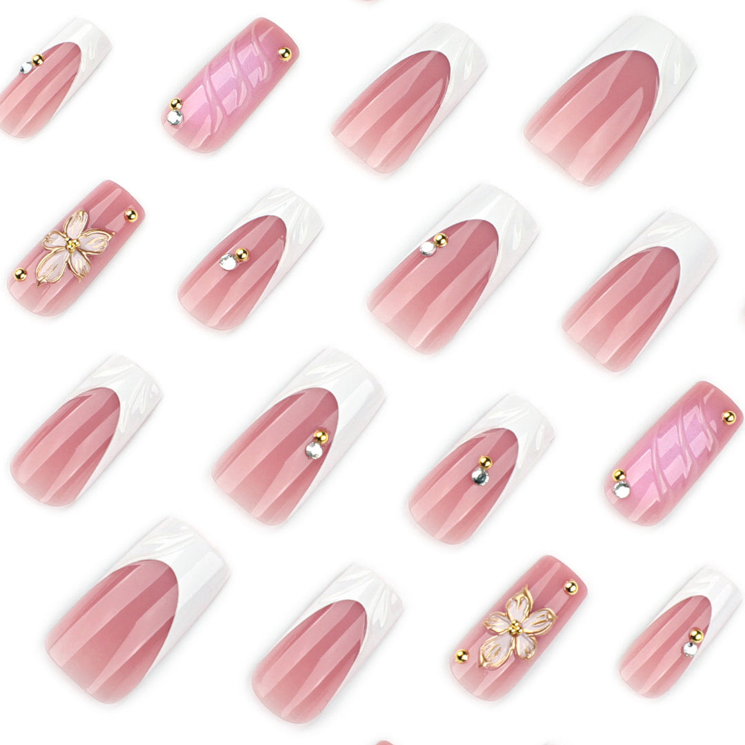 Glamorous gel nails with floral accent and glitter details Stornfield