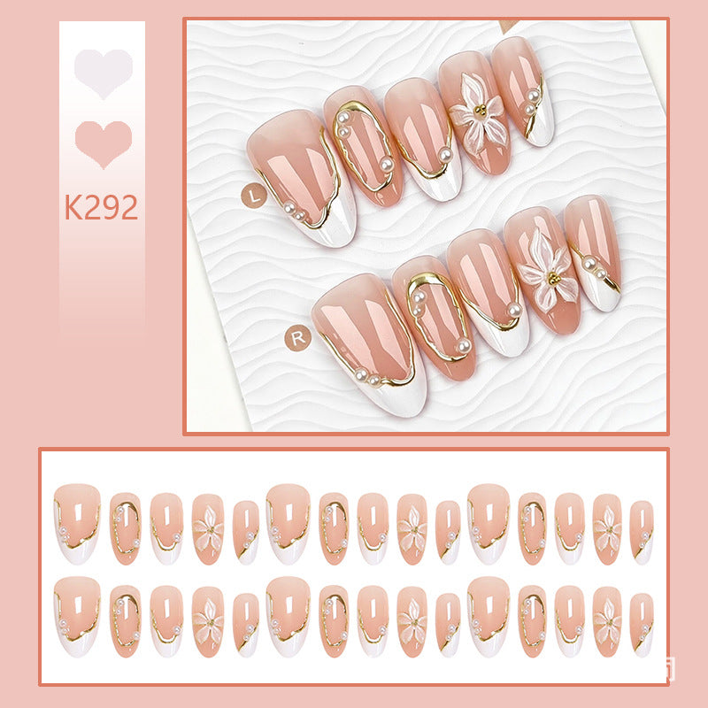 Artificial nail set with elegant floral design and glamorous 3D applications Stornfield