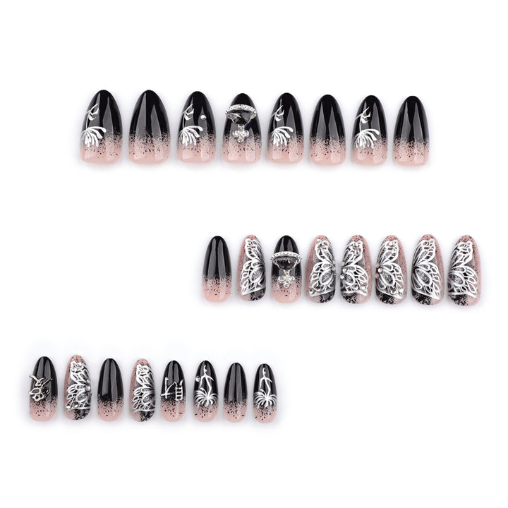 Artful stiletto nails with delicate embellishments and glamour accents Stornfield