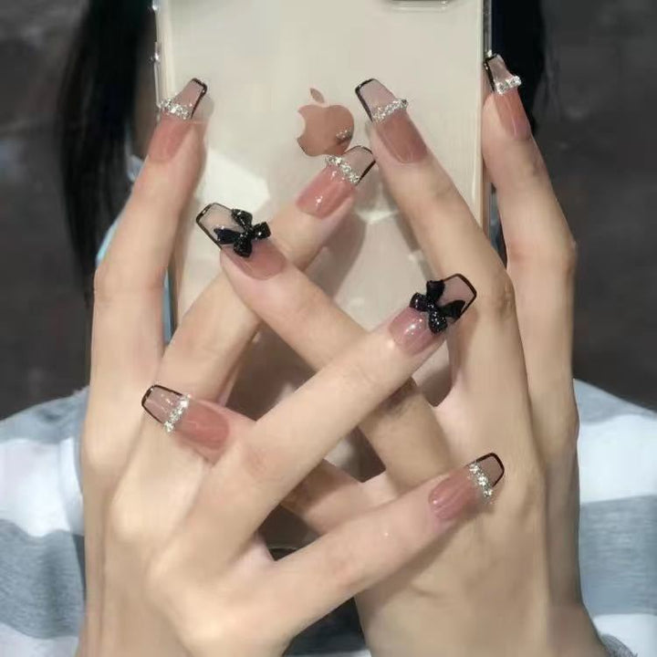 Artificial nails with heart design and glamorous accents Stornfield