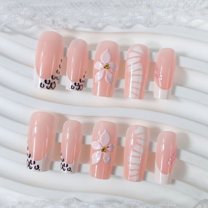 Elegant artificial nail set with floral and animal accents Stornfield