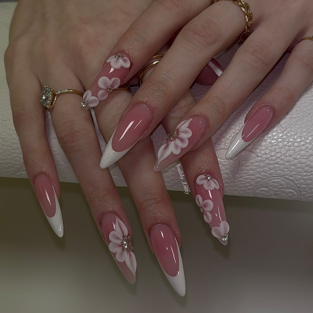 Elegant artificial nail set with floral design and glitter accents Stornfield