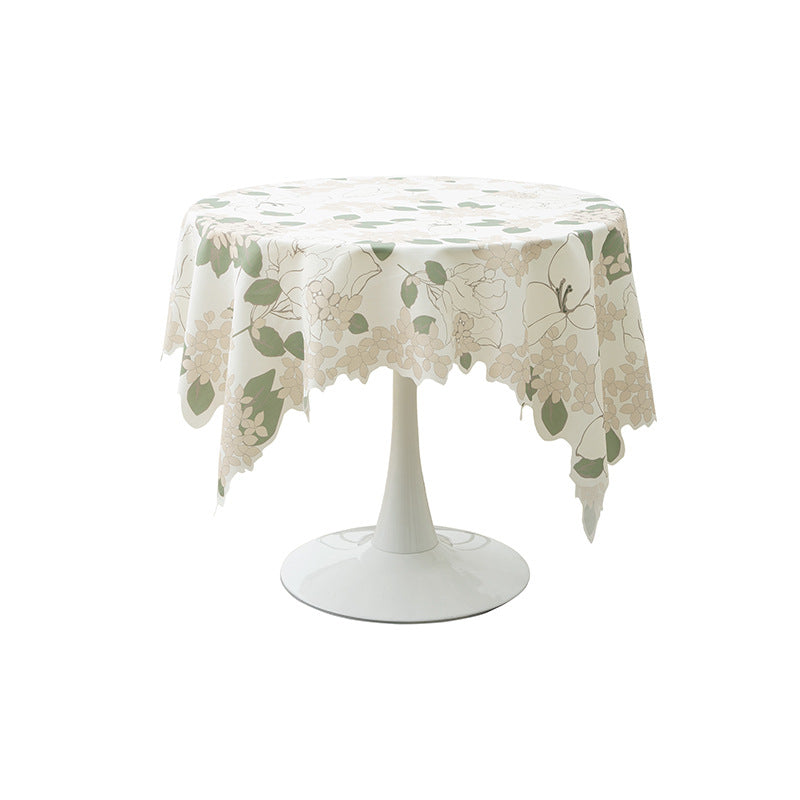 Round wipeable tablecloth with floral cut-out hem Stornfield