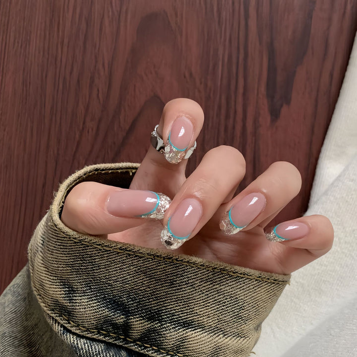 Artificial nails with shimmering glitter and elegant French-tip design Stornfield