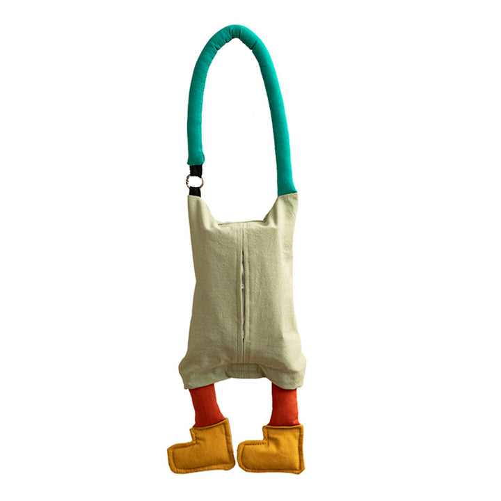 Shoulder bag with playful plush pendant and padded carrying handle