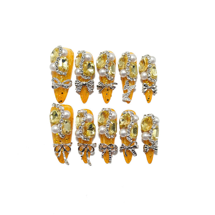 Glamorous artificial nails with rhinestones and pearl embellishments Stornfield