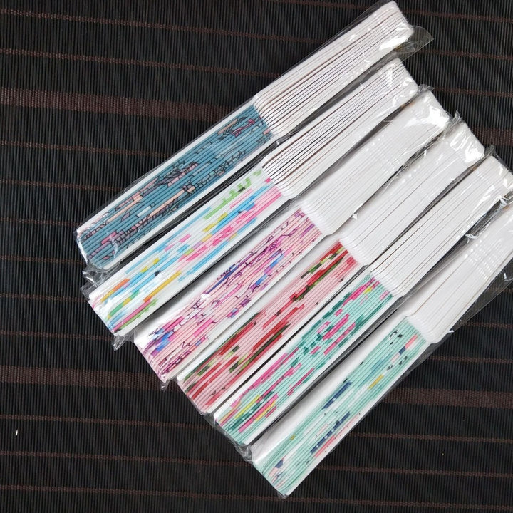 Women folding hand fan with shimmering scale pattern Stornfield