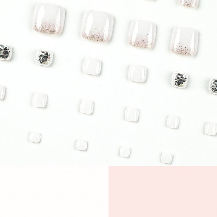 Artful toenail design with sparkling embellishments Stornfield