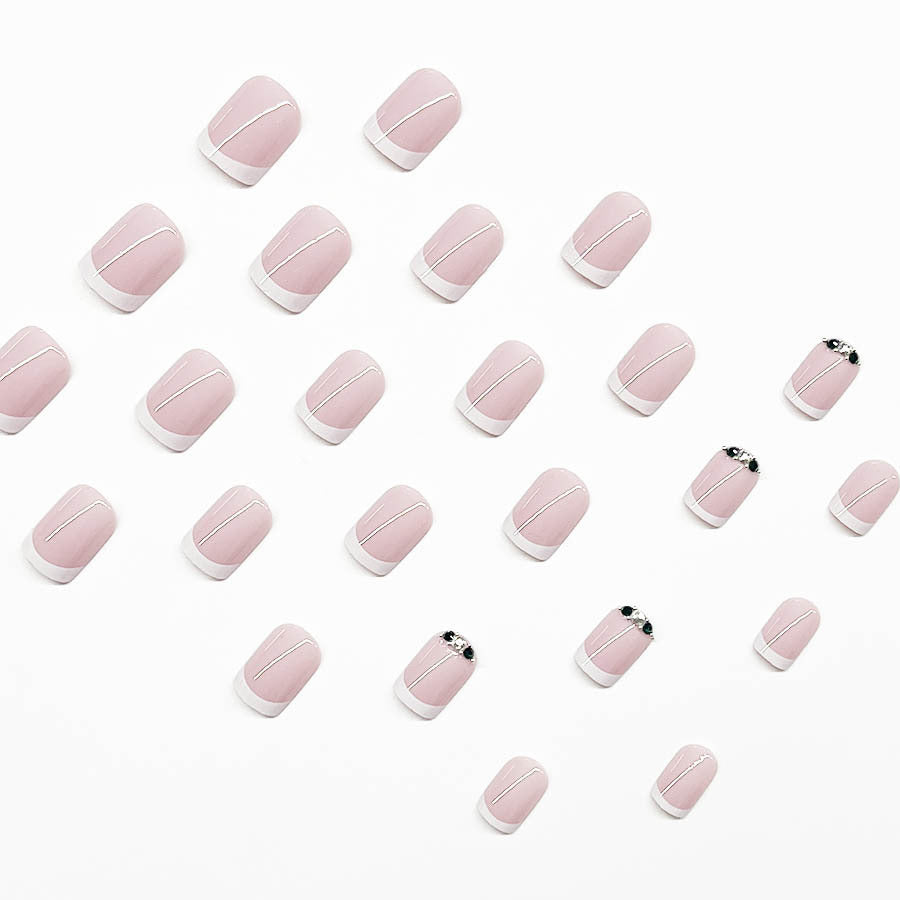 Art nail set with elegant French design and glittering accents Stornfield