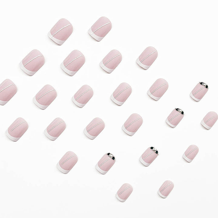 Art nail set with elegant French design and glittering accents Stornfield