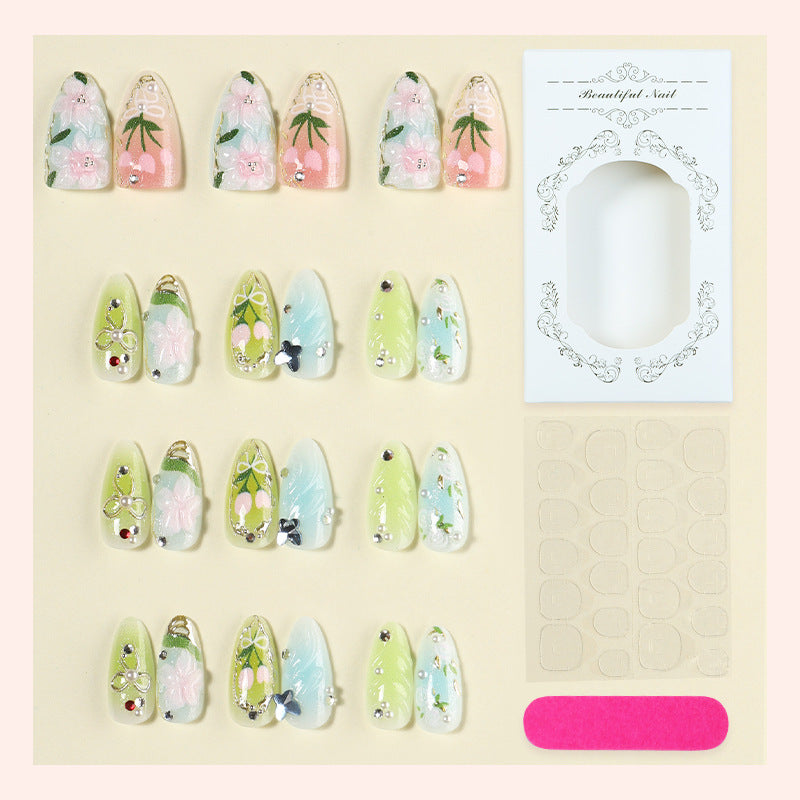 Acrylic nail set with handcrafted floral designs and glitter accents Stornfield
