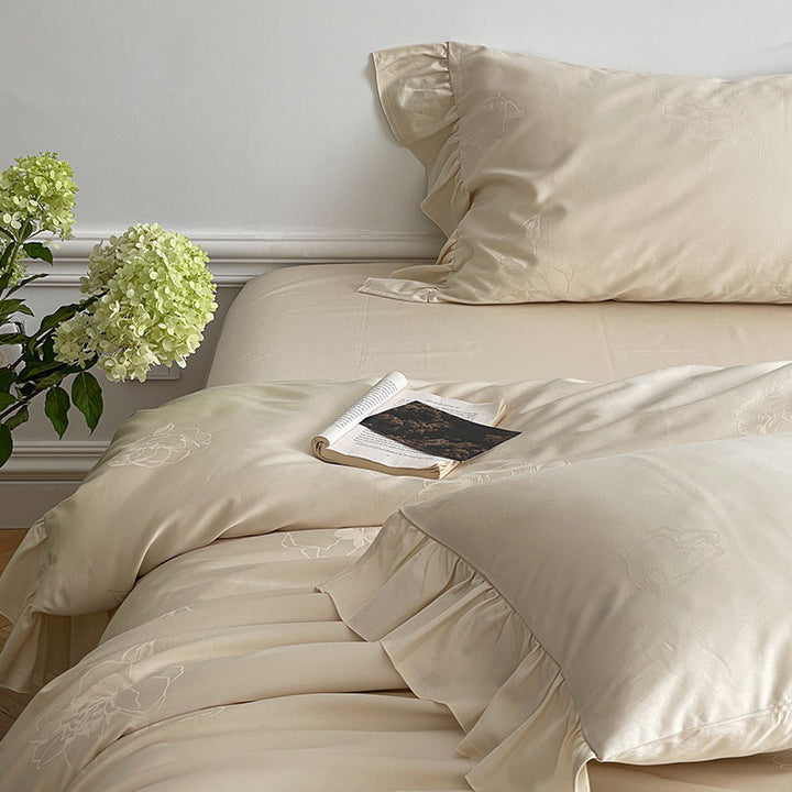 Bedding set made of cotton satin with ruffle, subtle jacquard floral relief and silky-matt finish