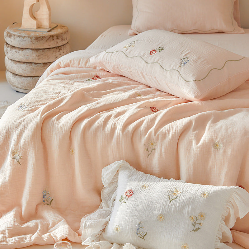 Light cotton gauze bedding set with fine floral embroidery and ruffle trim