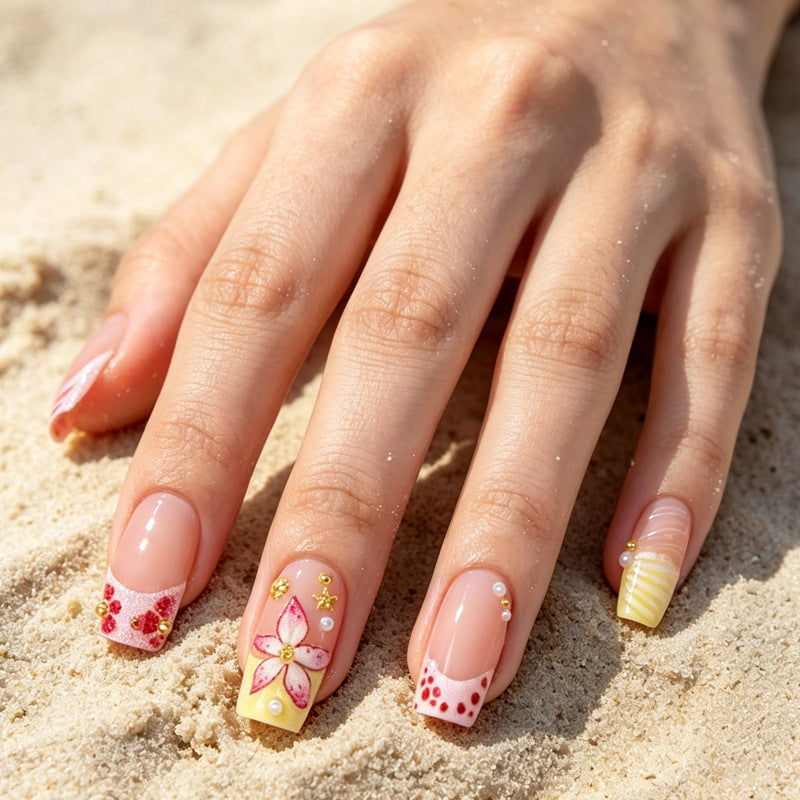 Nail art set with floral accents and glitter decorations Stornfield