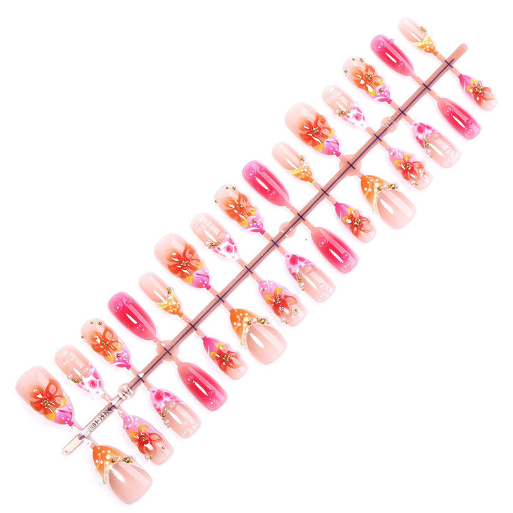 Artificial nail set with floral designs and elegant embellishments Stornfield