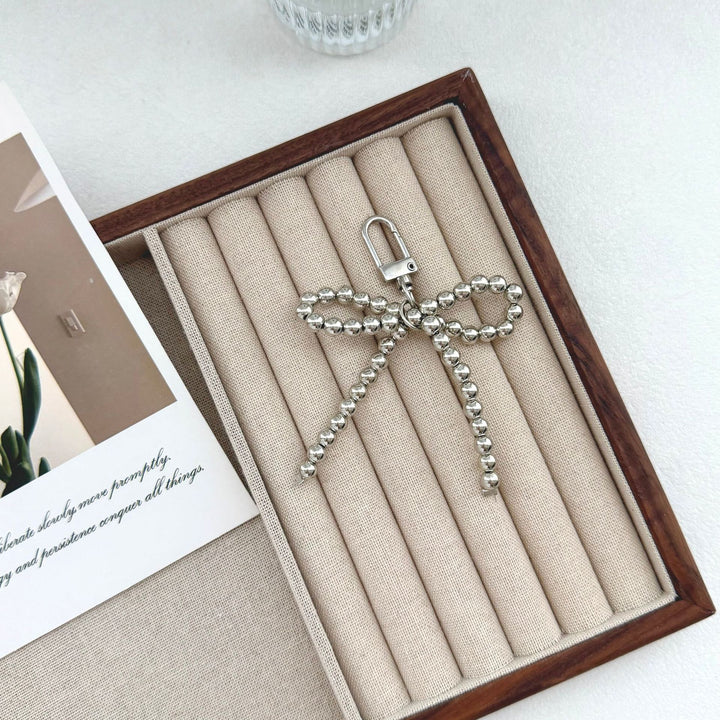 Elegant Pearl Bow Keychain Stornfield