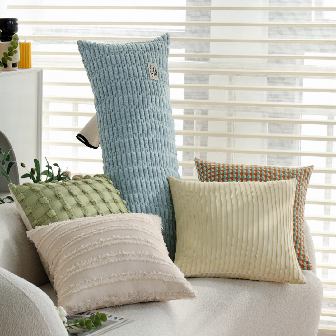 Long decorative pillows with structured surface
