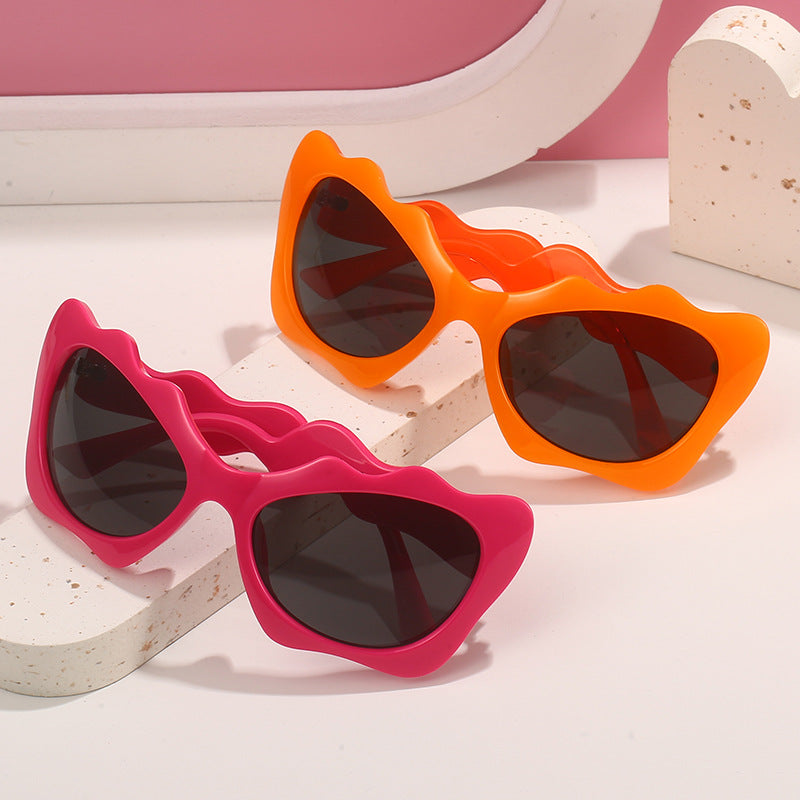 Ladies extravagant sunglasses with wavy frame design Stornfield