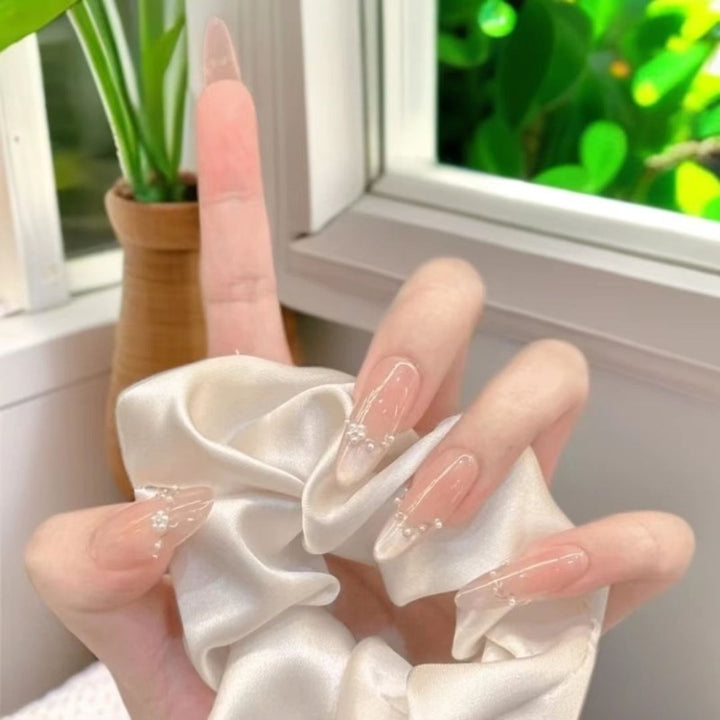 Decorative Acrylic Nail Extensions with Pearlescent Accents