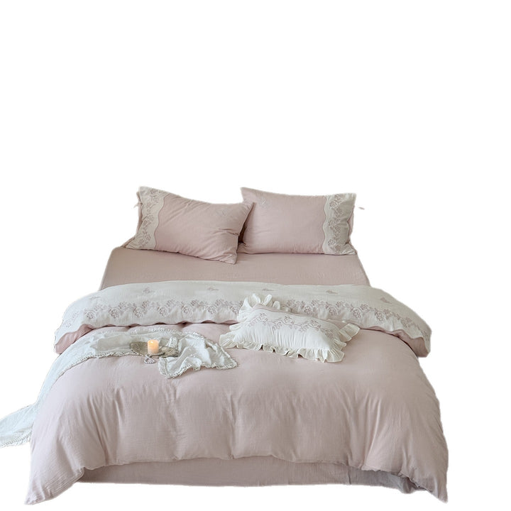 Flower-embroidered bedding set made of cotton-linen with ruffle hem