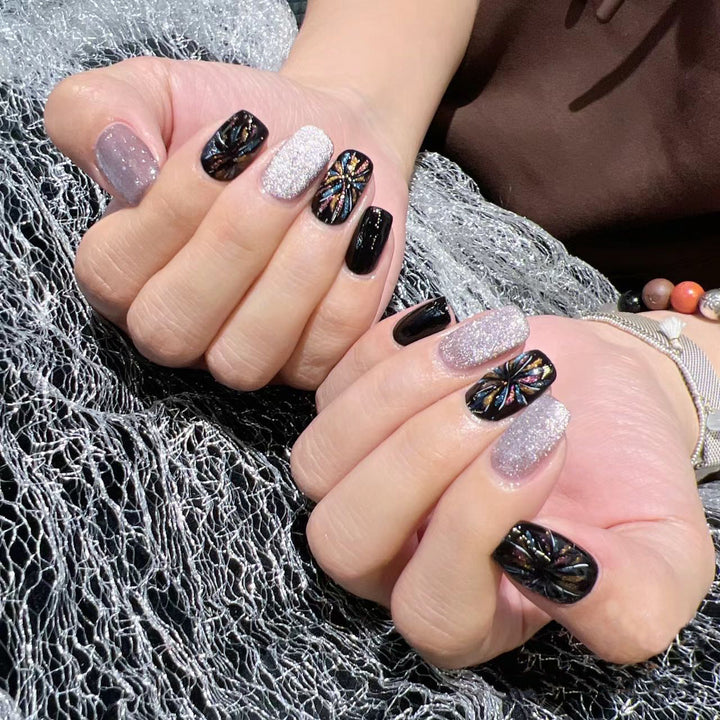 Artificial nails with glitter and floral patterns Stornfield