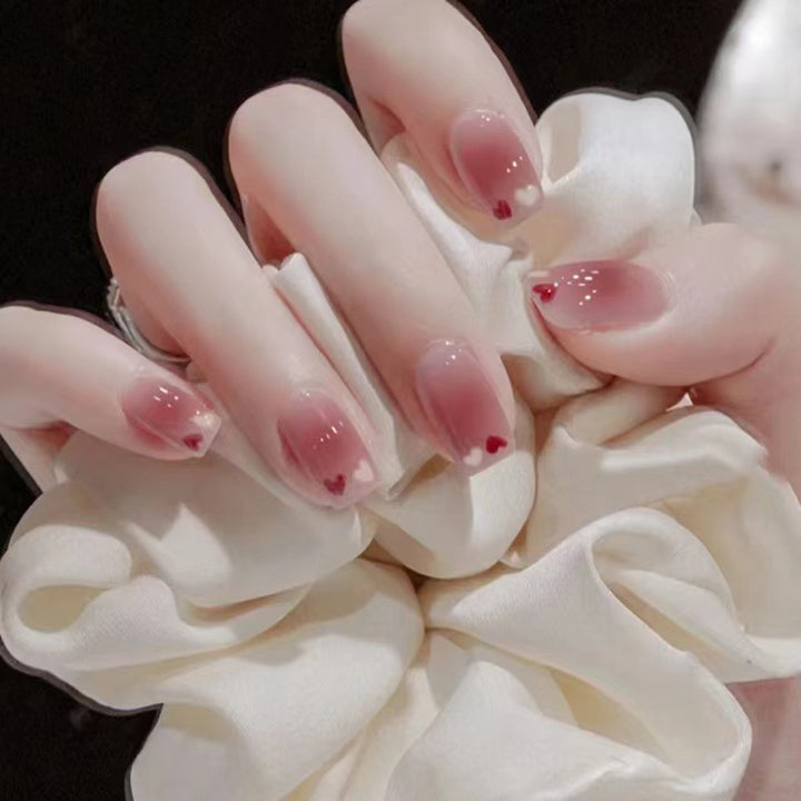 Glamorous artificial nails with delicate flower and glitter effects Stornfield