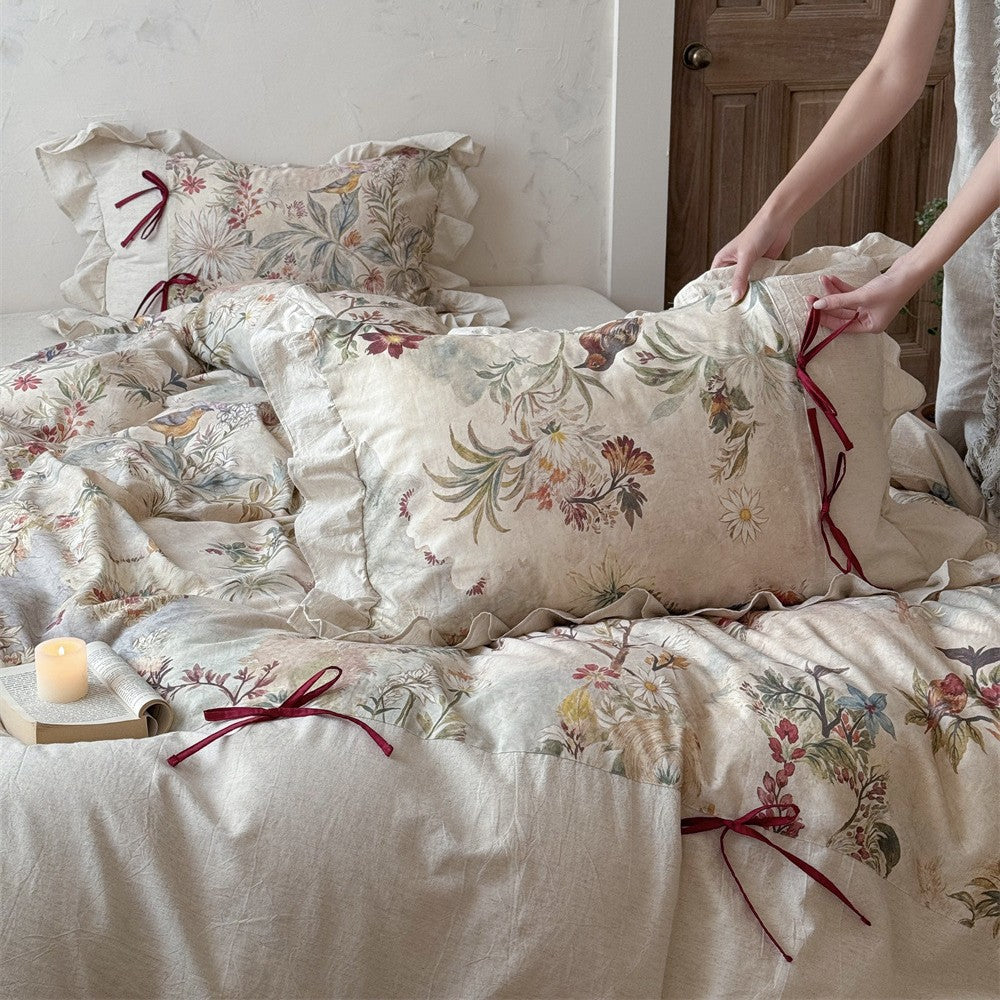 Bedding set with floral vintage linen look, ruffled pillow and bow tie