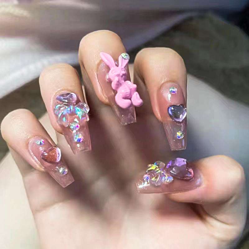 Artificial nail extensions with artistic decorations Stornfield