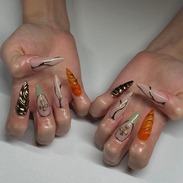 Artful stiletto nails with glitter and motif decorations Stornfield