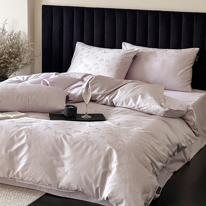 Jacquard bedding set made of cotton satin with subtle butterfly relief and reversible function