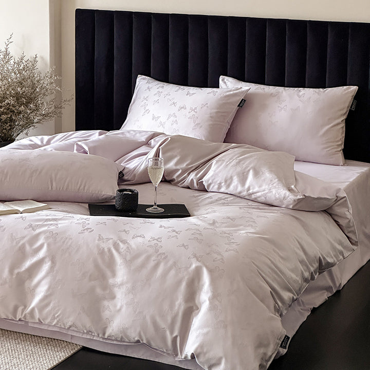 Jacquard bedding set made of cotton satin with subtle butterfly relief and reversible function