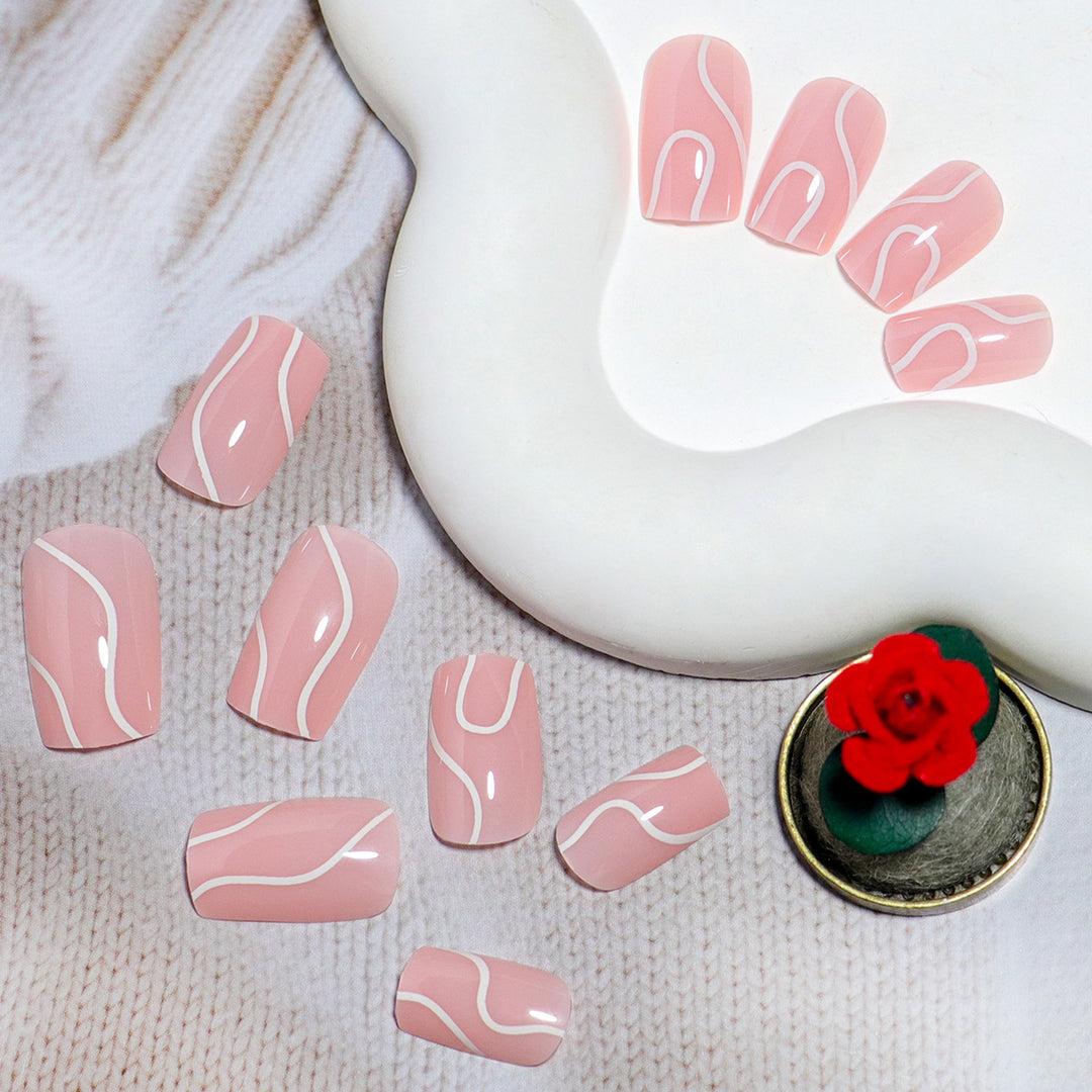 Elegant Press-On Nail Design with Artistic White Swirl Stornfield