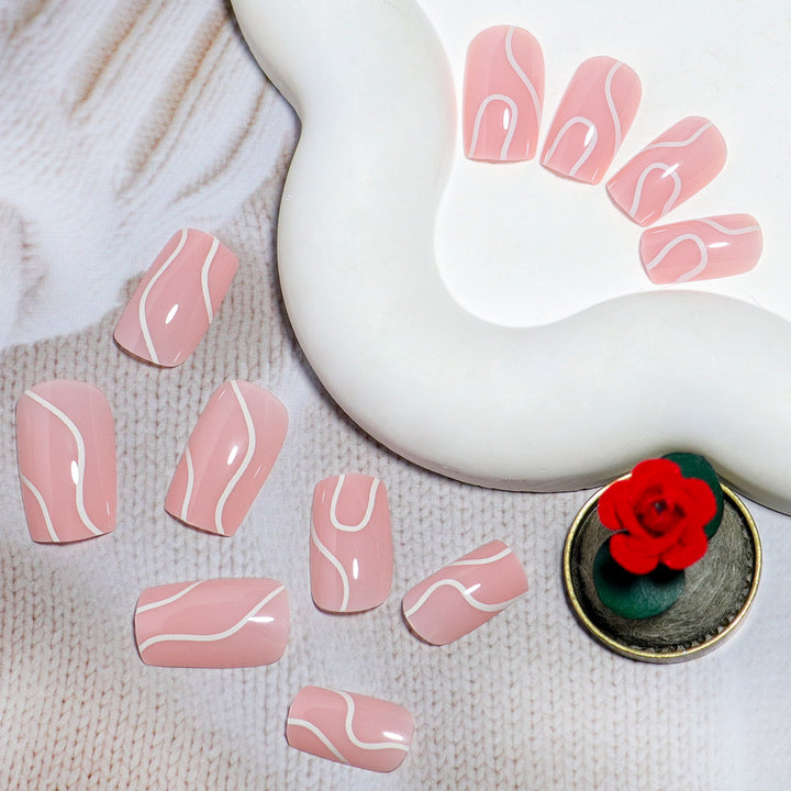 Elegant Press-On Nail Design with Artistic White Swirl Stornfield