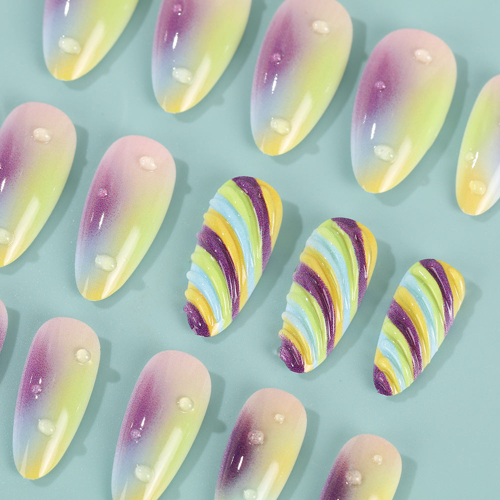 Artificial nails with soft ombre colors and creative patterns Stornfield