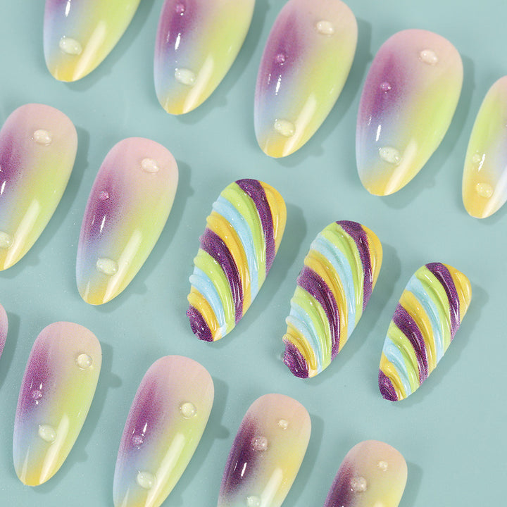 Artificial nails with soft ombre colors and creative patterns Stornfield