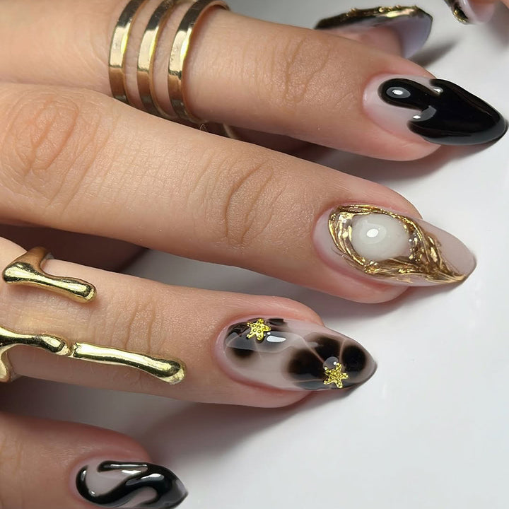 Elegant Stiletto Artificial Nails with Gold Accents and Modern Designs Stornfield