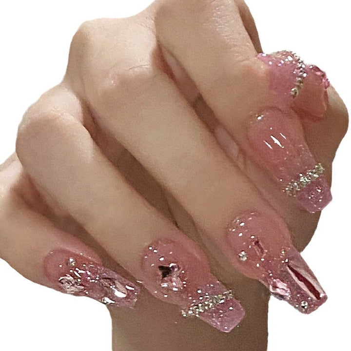 Artificial nails with heart design and glitter accents Stornfield