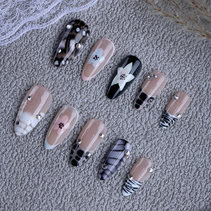 Nail art with elegant designs and embellishments Stornfield
