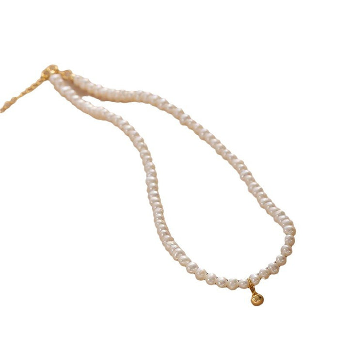 Delicate pearl necklace with elegant gold accent chain Stornfield