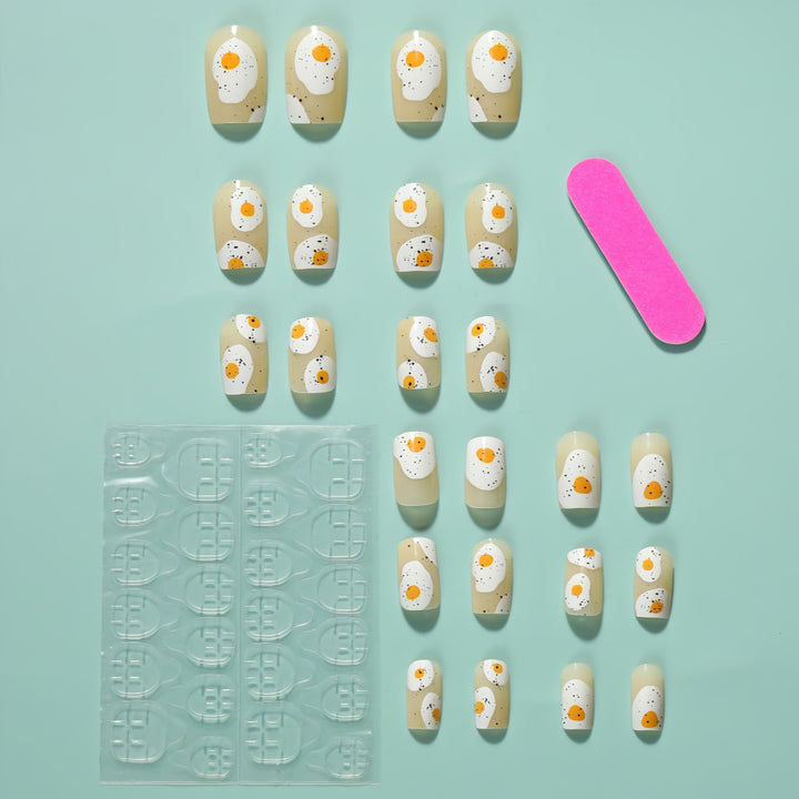 Artificial nails in creative fried egg design Stornfield