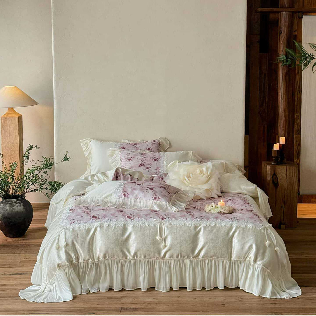 Romantic bedding and bedspread set with ruffles, lace trim, and floral quilting