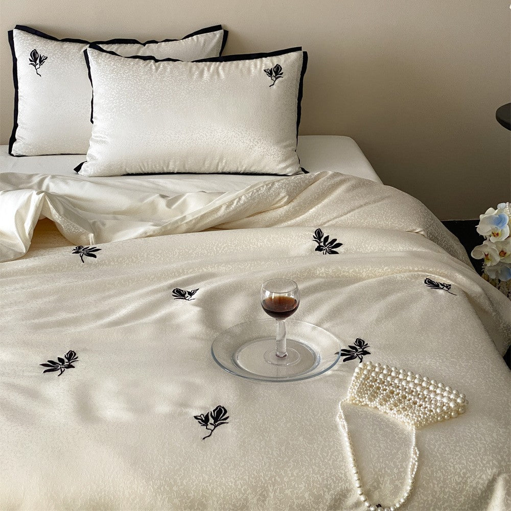 Reversible Jacquard Sateen Duvet Cover Set with Minimalist Botanical Embroidery and Contrast Piped Shams