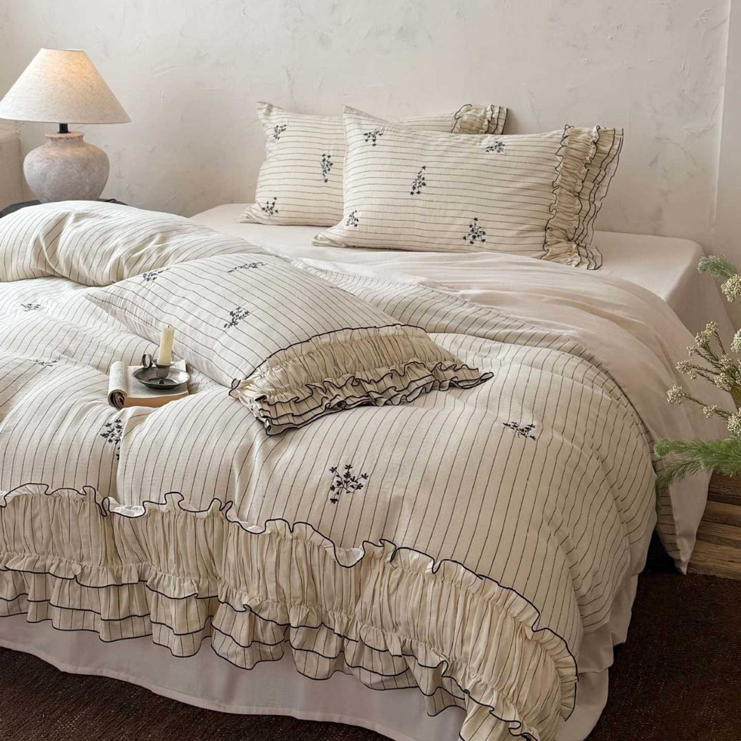 Romantic bedding set with ruffle, fine floral embroidery and pinstripes