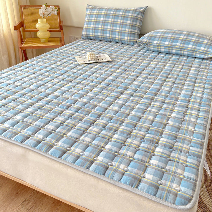 Padded mattress protector-topper with quilting and non-slip underside