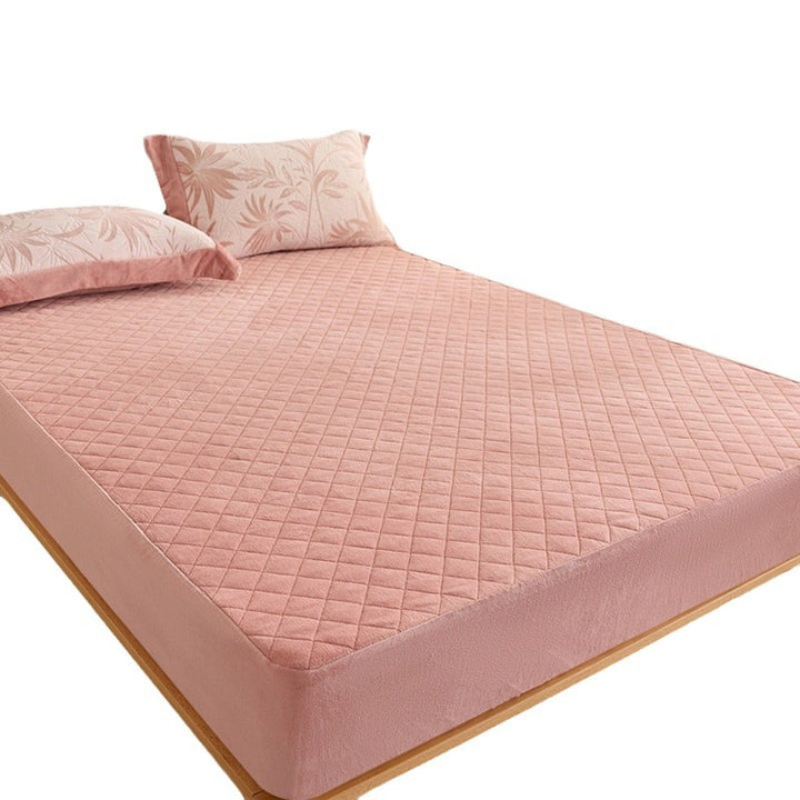 Quilted mattress protector with non-slip bottom and soft microfiber cover