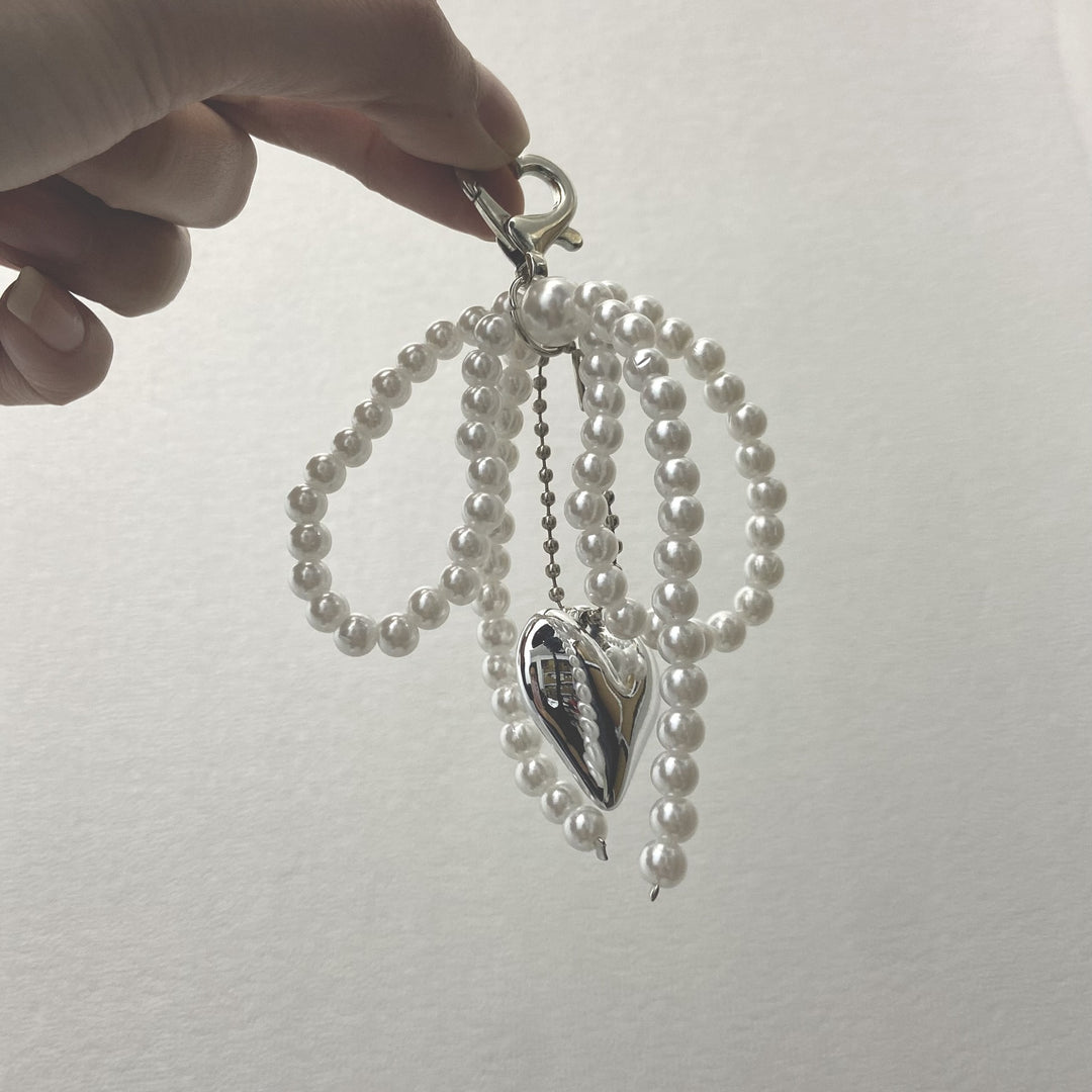 Elegant Pearl Bow Keychain Stornfield