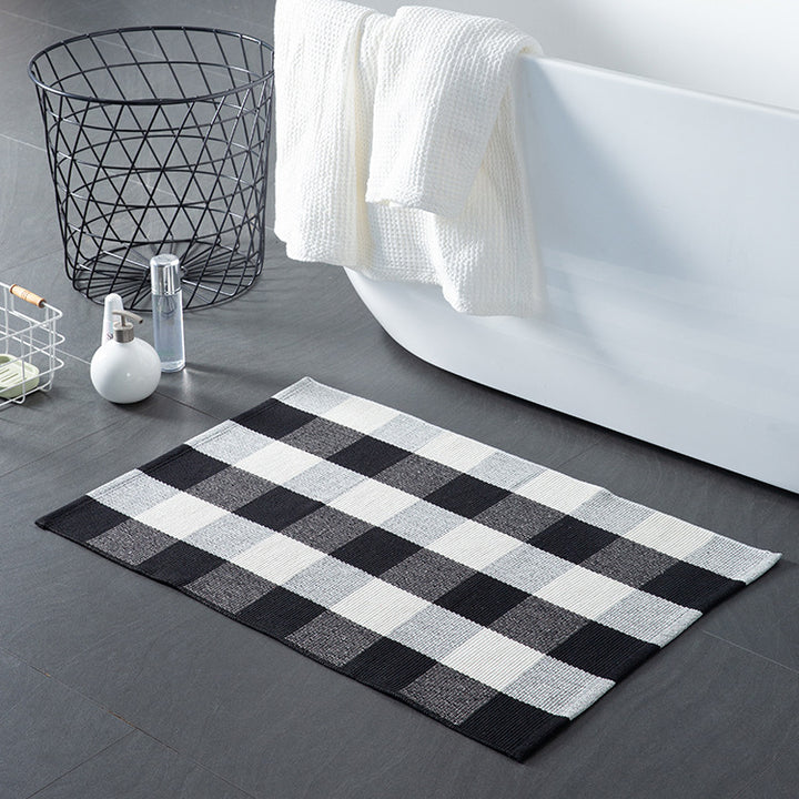 Striped cotton doormat with non-slip bottom and decorative woven edge Stornfield